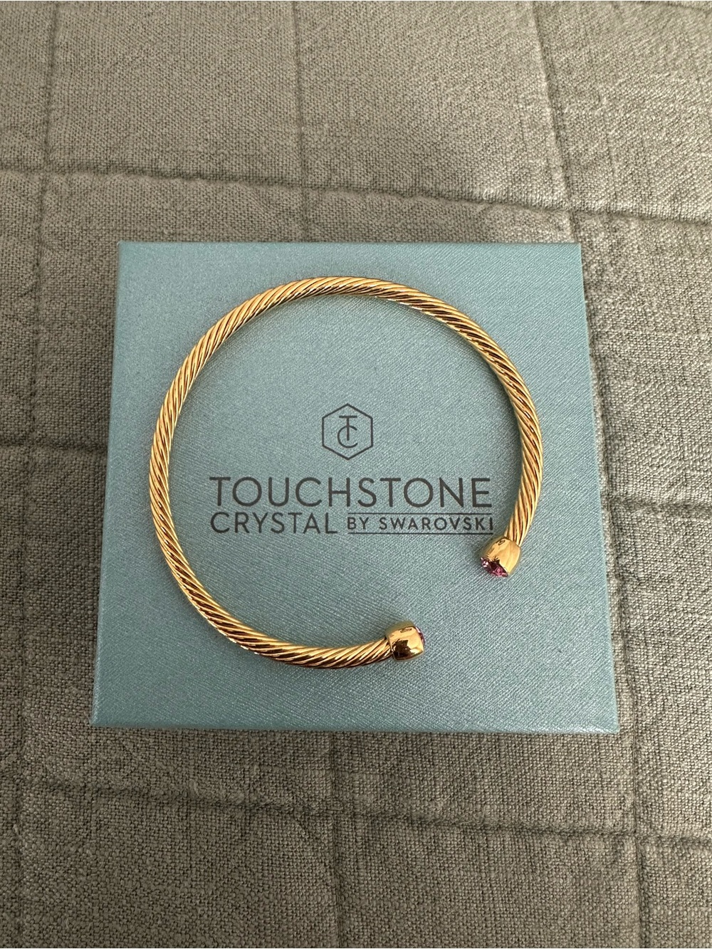 Touchstone Crystal Gold Twisted Open Cuff Bracelet with Pink Accent